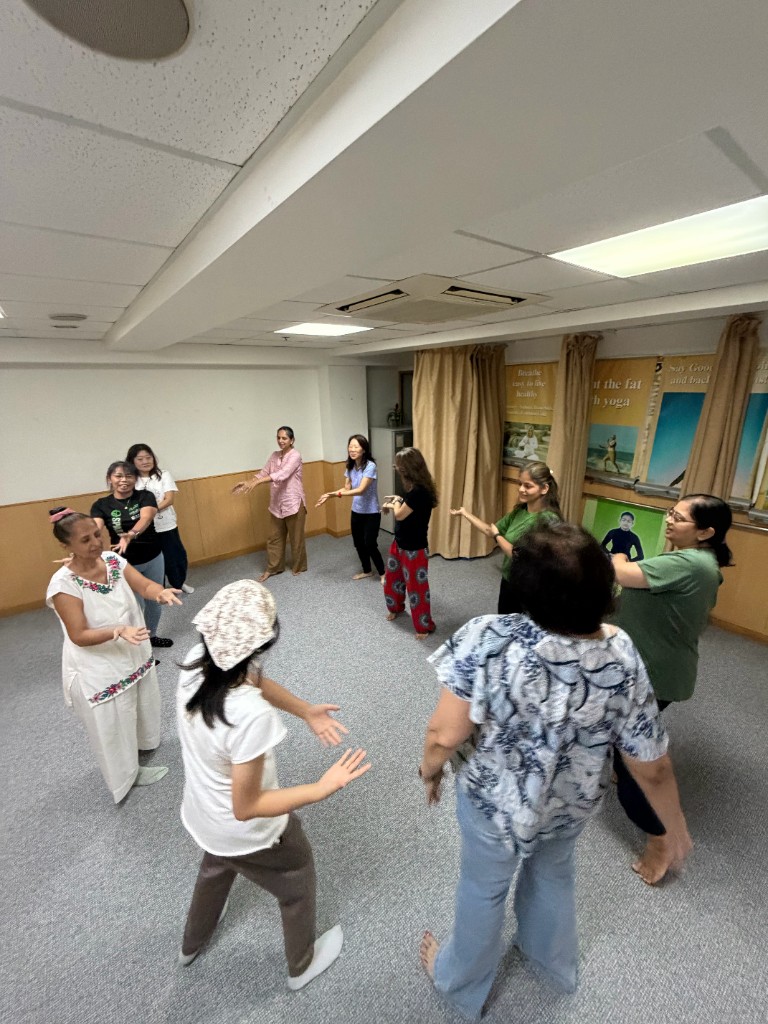Volunteer group circle activity at Life Management Yoga Centre